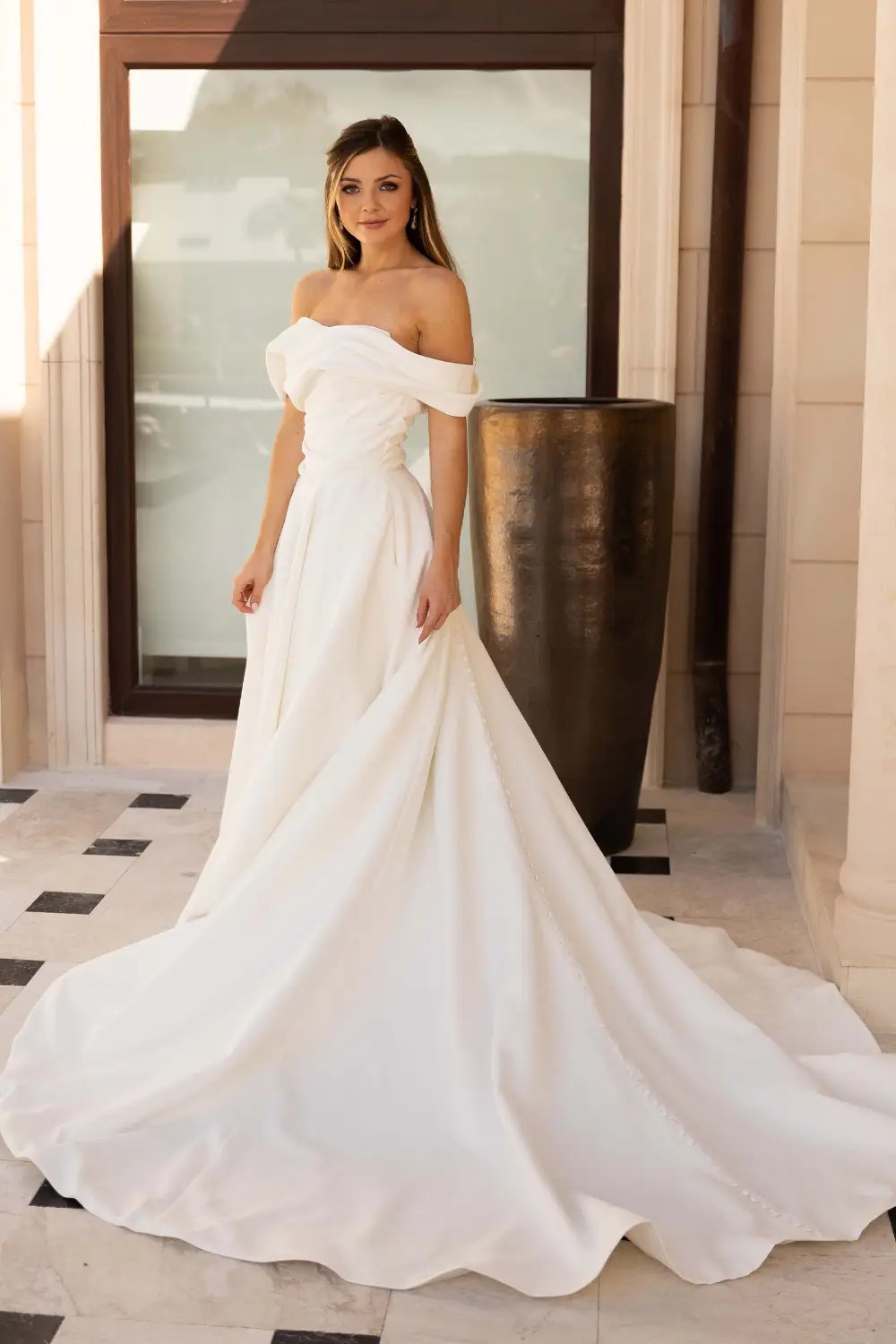 Model wearing a white dress 2025