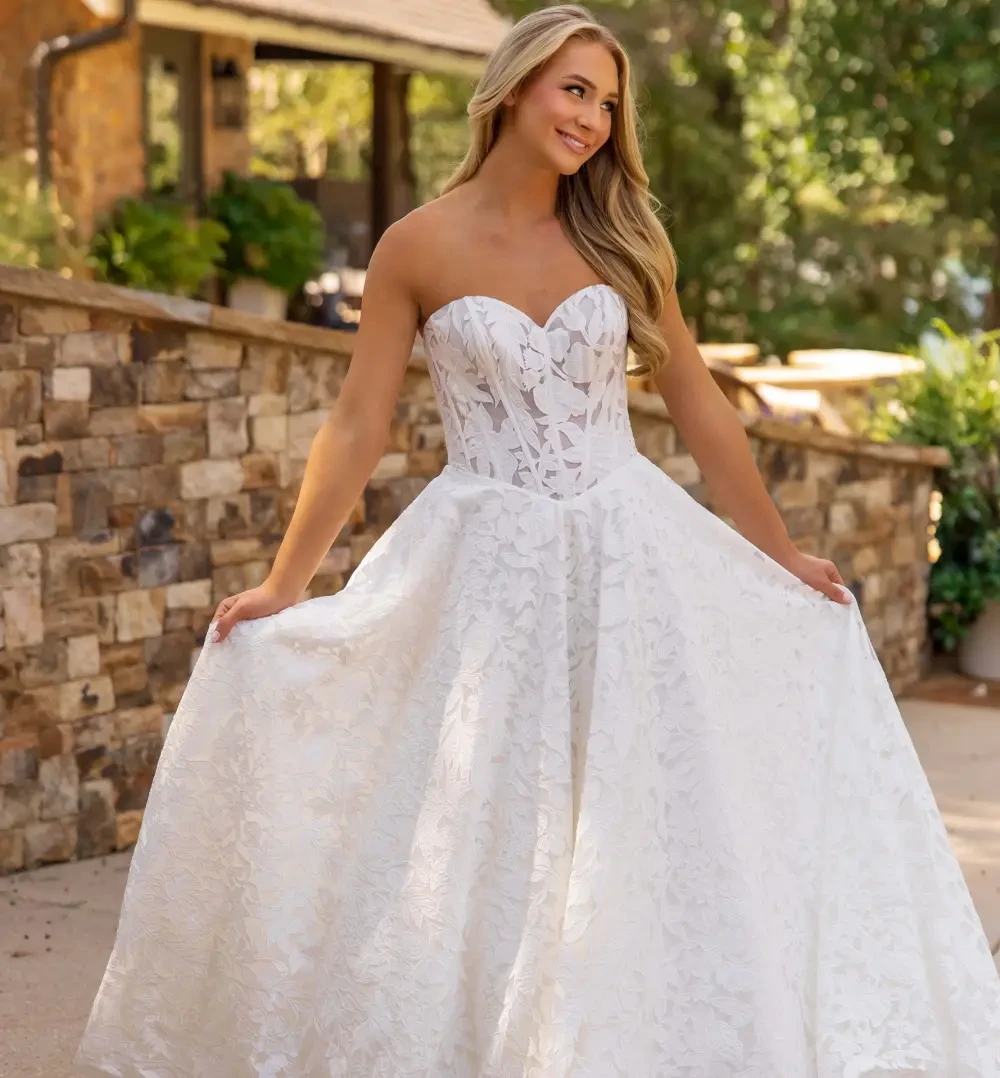 Model wearing a white dress 2025